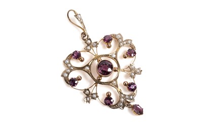 Lot 673 - An Edwardian amethyst and seed pearl pendant