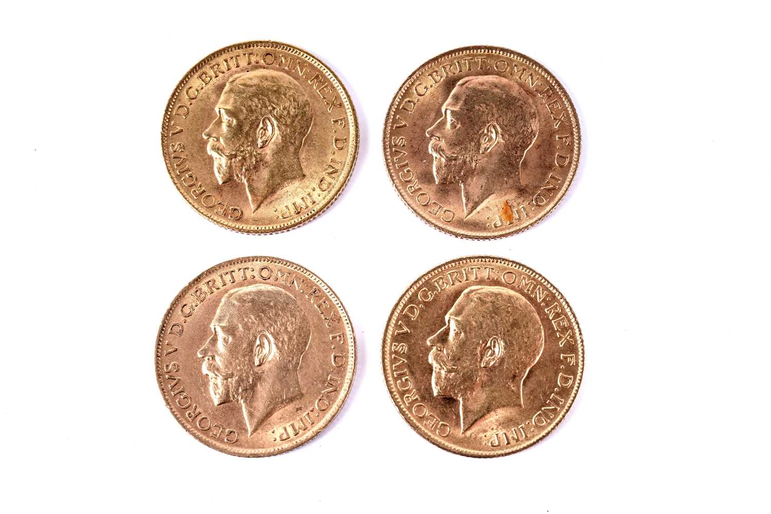 Lot 1205 - Four George V gold sovereigns