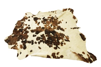 Lot 1950 - A cowhide rug; and one other