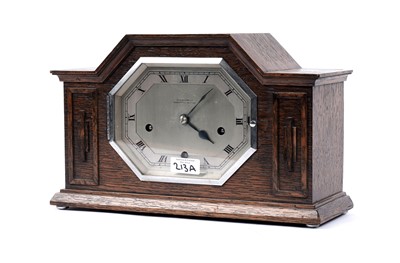 Lot 213A - ﻿An Art Deco oak cased mantel clock, by Reid & Sons Ltd., Newcastle-on-Tyne