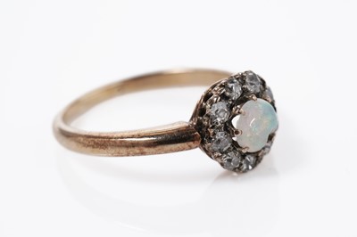 Lot 840 - An opal and diamond cluster ring