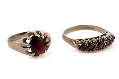 Lot 841 - Two garnet dress rings