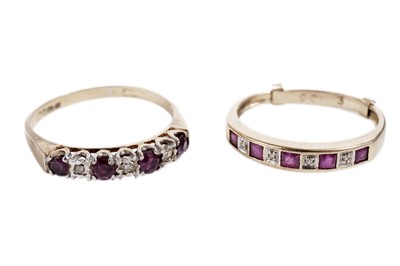 Lot 873 - Two ruby and diamond half hoop eternity rings