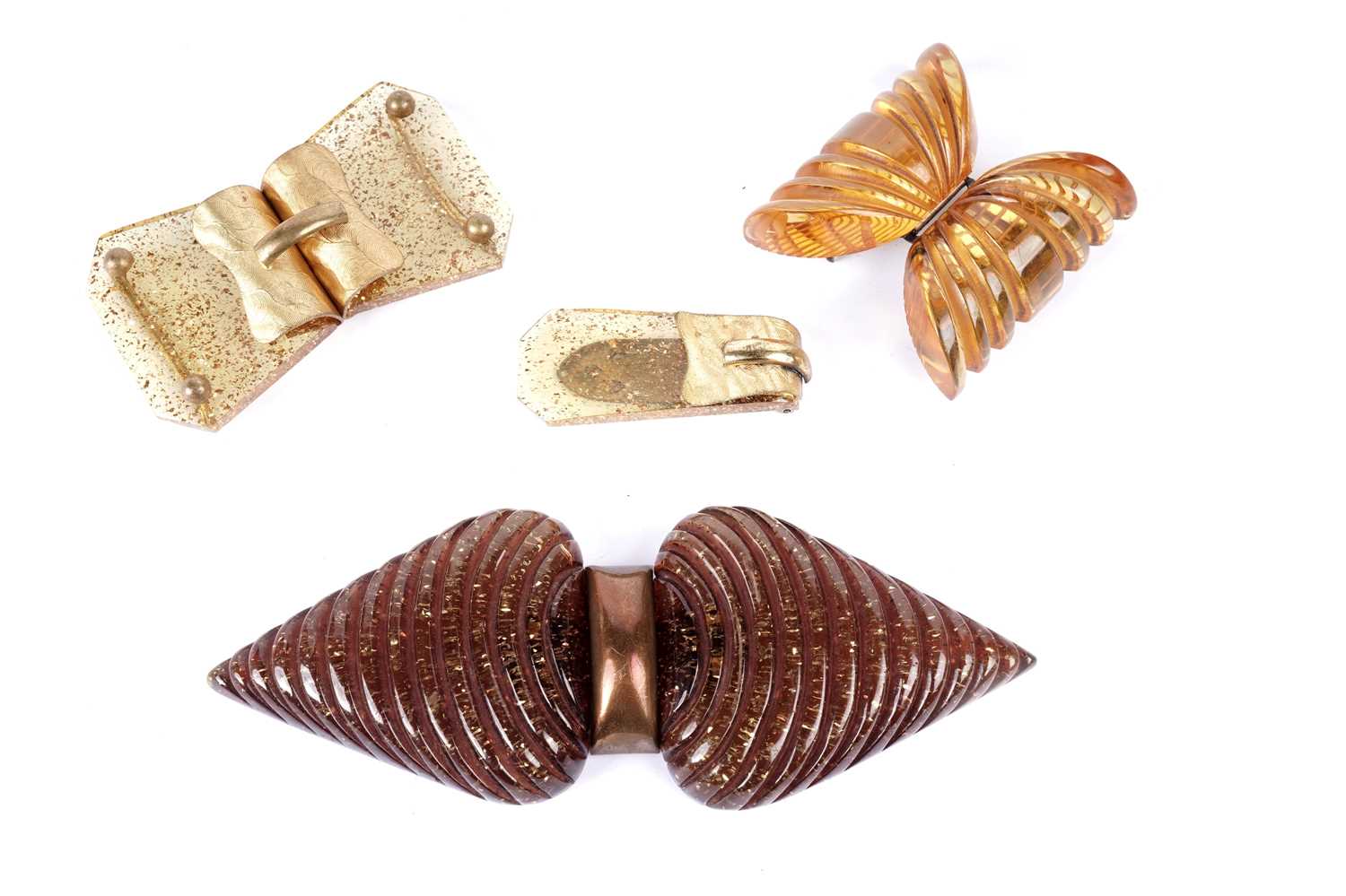 Lot 184 - Three 1930's celluloid buckles