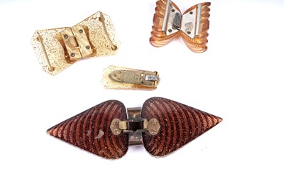 Lot 184 - Three 1930's celluloid buckles