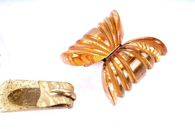 Lot 184 - Three 1930's celluloid buckles