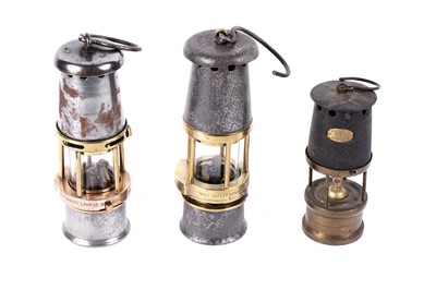 Lot 1424 - Three miners' lamps