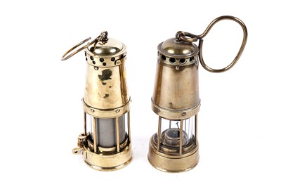 Lot 1429 - Two brass bonneted ‘Clanny’ lamps