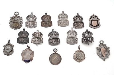 Lot 938 - A selection of silver medals and badges