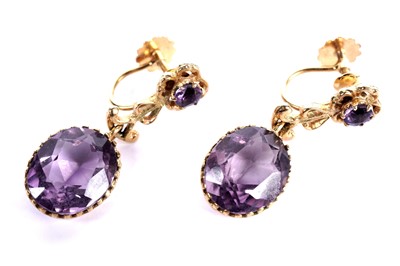 Lot 898 - A pair of amethyst and 9ct yellow gold drop earrings