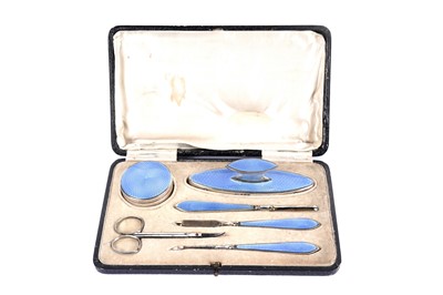 Lot 1062 - A George V silver and enamel manicure set