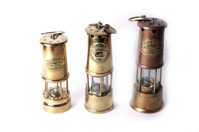 Lot 1456 - Three brass miners’ lamps