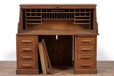 Lot 85 - An early 20th Century oak rolltop desk