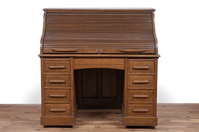 Lot 88 - An early 20th Century oak rolltop desk