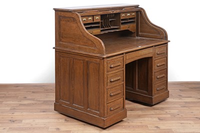 Lot 88 - An early 20th Century oak rolltop desk