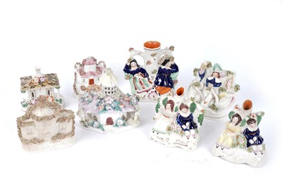 Lot 403 - Four Staffordshire figures; and four Staffordshire cottages