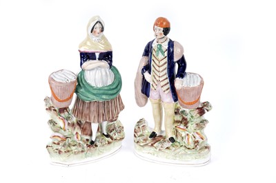 Lot 406 - A pair of Staffordshire fisherfolk