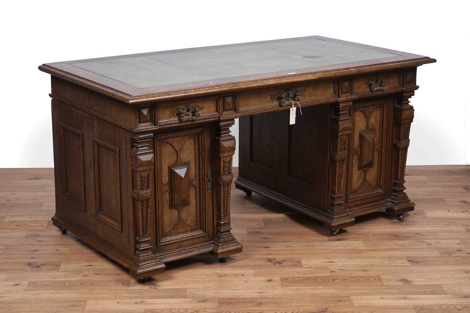 Lot 44 - An early 20th Century German carved oak pedestal desk