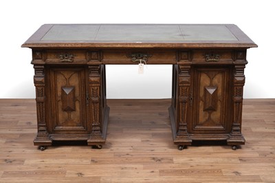 Lot 44 - An early 20th Century German carved oak pedestal desk