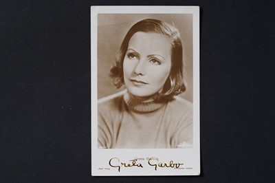 Lot 710 - A Greta Garbo signed photographic portrait postcard