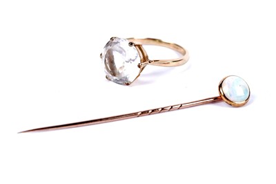 Lot 36 - A white topaz solitaire dress ring; and an opal stick pin