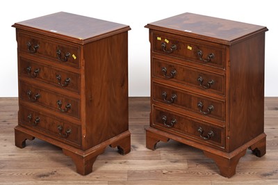 Lot 135 - A pair of Georgian style yew veneered bedside chests