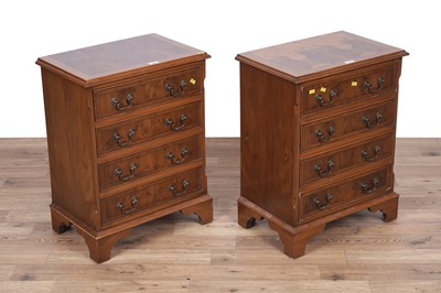 Lot 135 - A pair of Georgian style yew veneered bedside chests