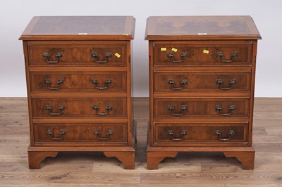 Lot 135 - A pair of Georgian style yew veneered bedside chests
