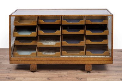 Lot 147 - An early 20th Century oak haberdashery cabinet