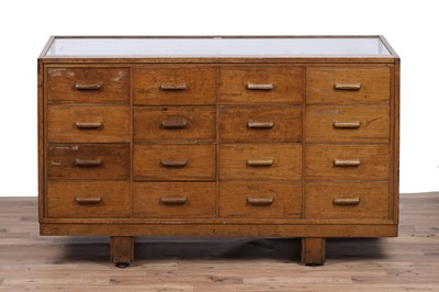 Lot 147 - An early 20th Century oak haberdashery cabinet