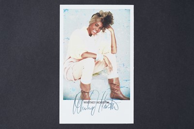 Lot 734 - A Whitney Houston autographed photographic postcard from the How Will I Know album