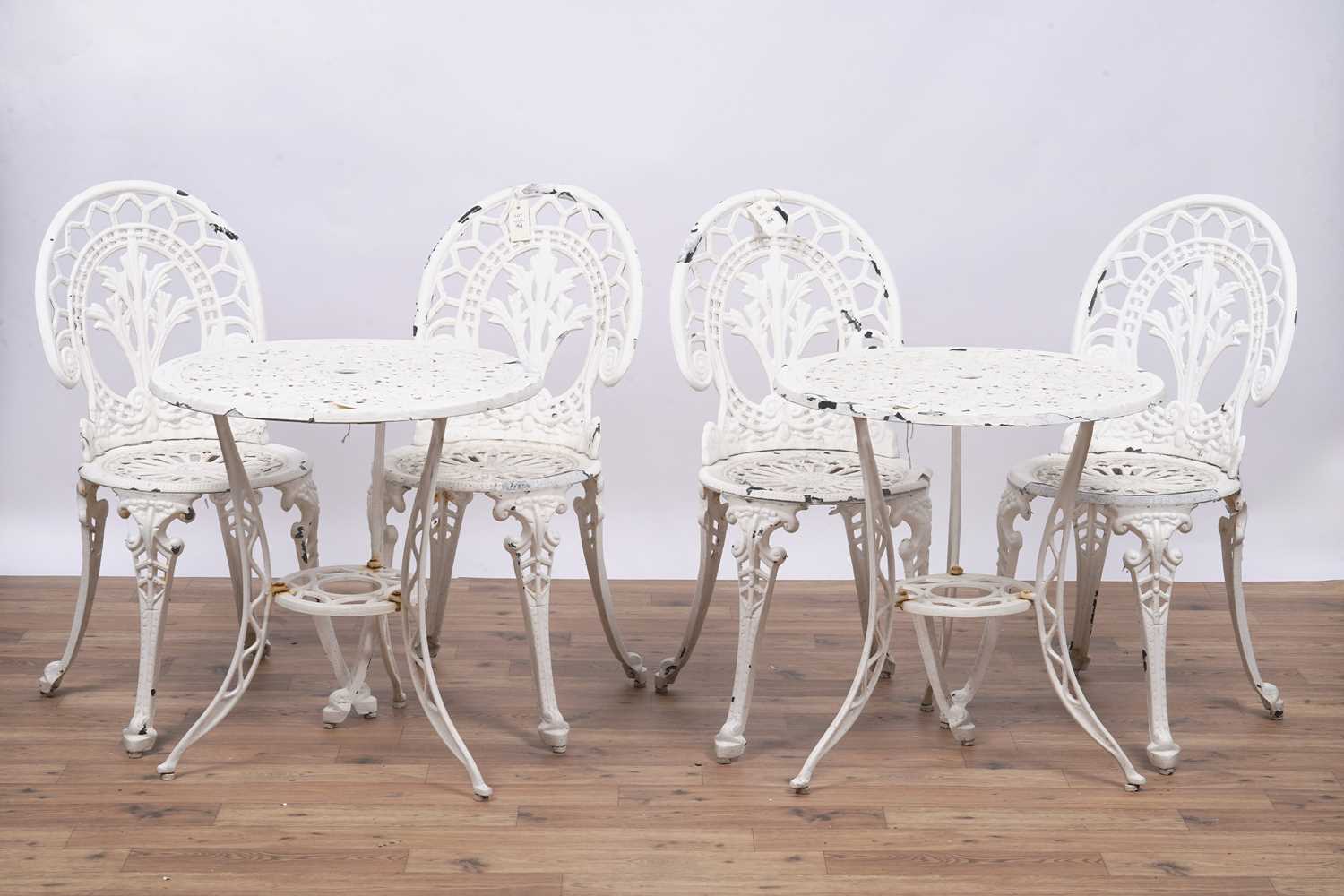 Lot 158 - A set of four Victorian style garden bistro cast metal chairs and two tables
