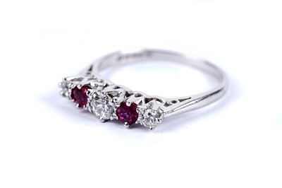 Lot 84 - A diamond and ruby five stone dress ring