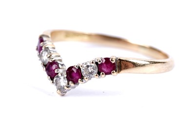 Lot 88 - A diamond and ruby wishbone ring