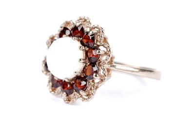 Lot 28 - An opal and garnet cluster ring