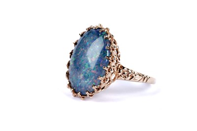 Lot 43 - An opal triplet dress ring