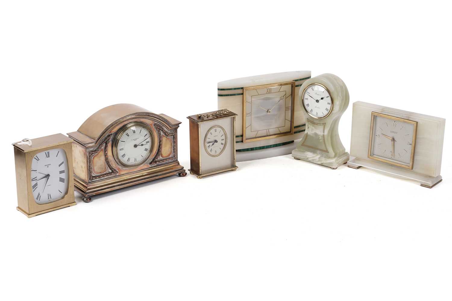 Lot 215 - An Elliot onyx mantle clock; and five others