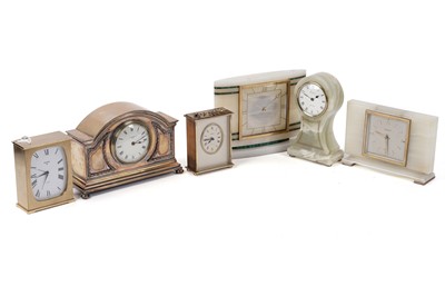 Lot 215 - An Elliot onyx mantle clock; and five others