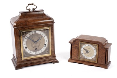 Lot 217 - An Elliot of London walnut mantle clock; and one other