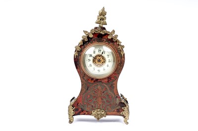 Lot 237 - A collection of clocks and decorative items including: a boulle and ormolu mounted mantle clock