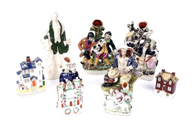 Lot 416 - A selection of Staffordshire figures and vases; and three ceramic cottages