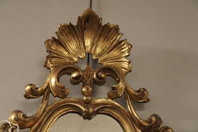Lot 182 - A 19th Century Rococo style carved giltwood and gesso mirror