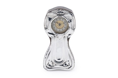 Lot 278 - An Art Nouveau silver fronted miniature mantle clock