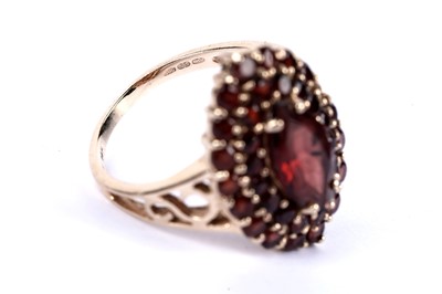 Lot 44 - A garnet cluster dress ring; and another ring