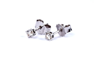 Lot 9 - A pair of diamond stud earrings