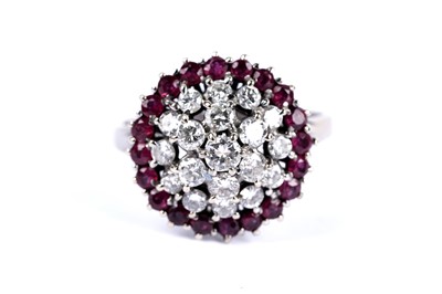 Lot 14 - A diamond and ruby cluster dress ring