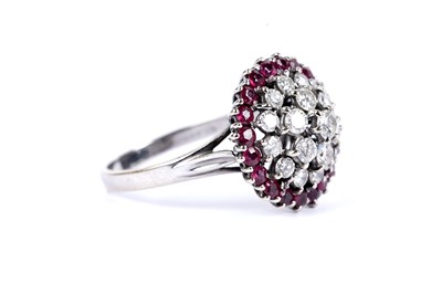 Lot 14 - A diamond and ruby cluster dress ring