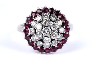 Lot 14 - A diamond and ruby cluster dress ring