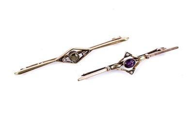 Lot 24 - An amethyst and seed pearl bar brooch; and another