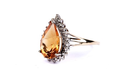 Lot 51 - A citrine and diamond ring